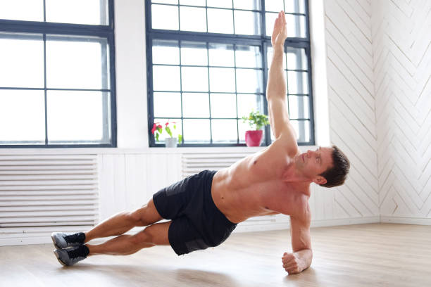 istock A man doing stomach workouts on the floor. 914535026