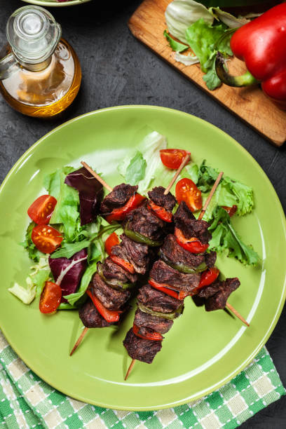 istock Grilled beef meat and vegetable kebabs 914535238