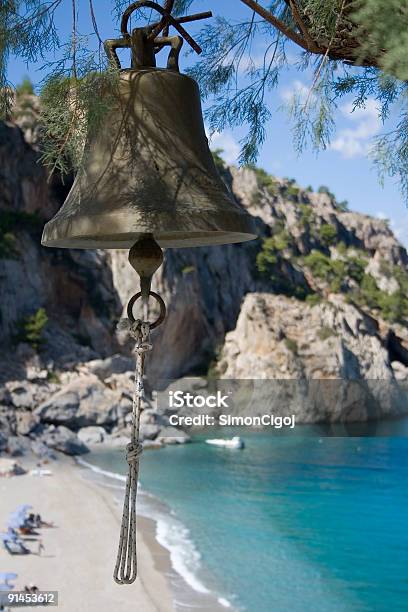 Bell Above Kira Panagia Beach Stock Photo - Download Image Now - Beach, Bell, Blue