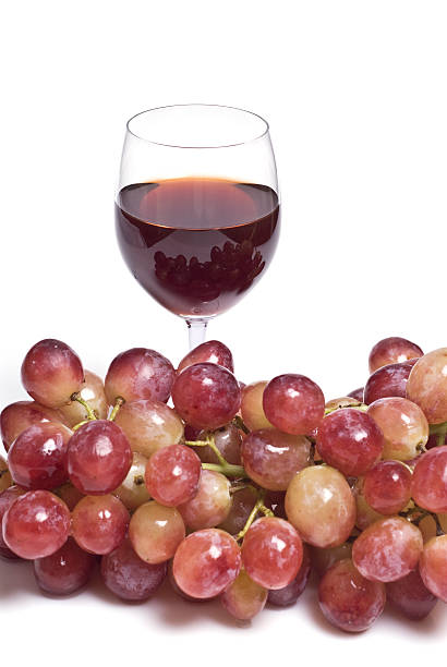Red grapes and a wine glass
