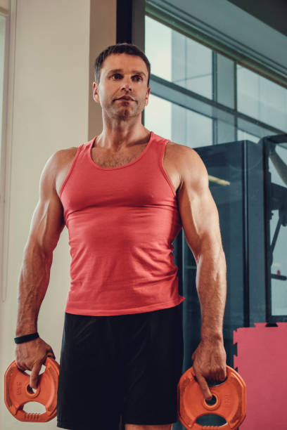 istock Middle age man in a red t shirt. 914538546
