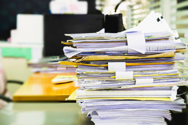 istock Pile of unfinished documents on office desk, Stack of business paper 914540806
