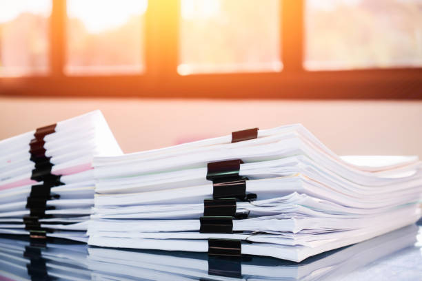 istock Pile of unfinished documents on office desk, Stack of business paper 914540810