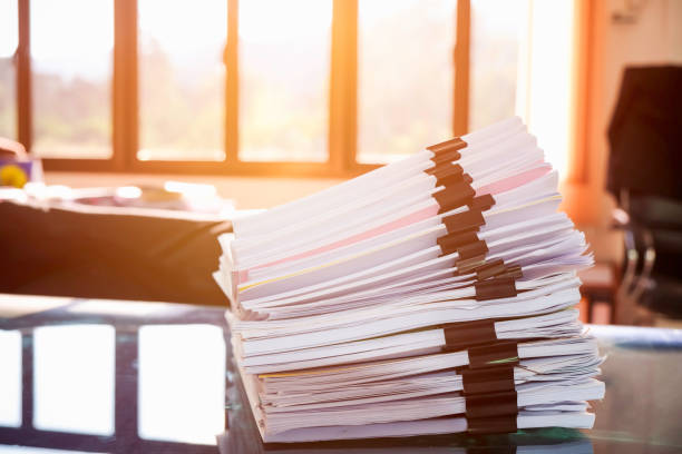 istock Pile of unfinished documents on office desk, Stack of business paper 914540814