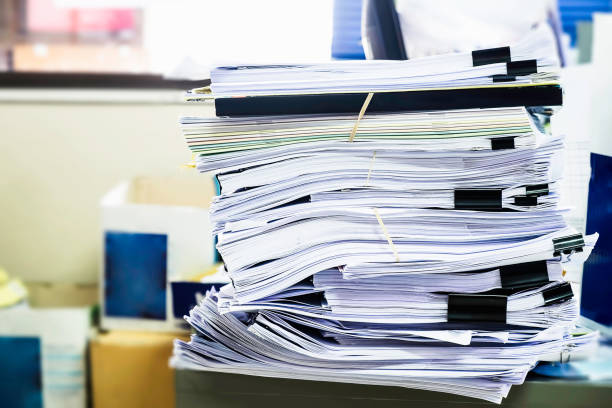 istock Pile of unfinished documents on office desk, Stack of business paper 914540816