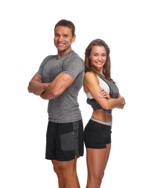 istock Smiling sporty couple isolated on a white background. 914540888
