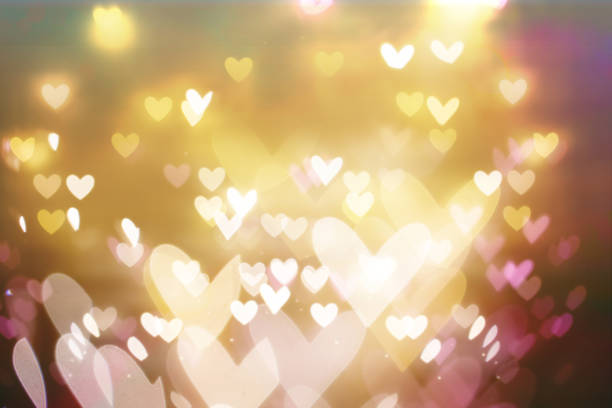 istock Beautiful shiny hearts and abstract lights 914541350