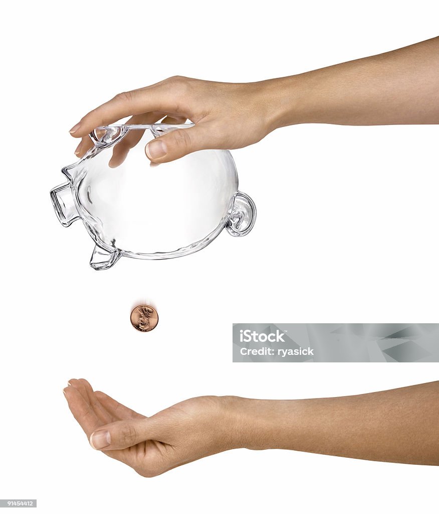 Weibliche Hand Holding leer Sparschwein auf den Kopf gestellt Isoliert - Lizenzfrei Währung Stock-Foto
