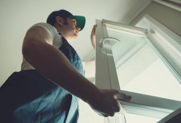istock Professional handyman installing window at home. 914545822