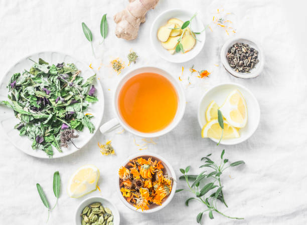 istock Flat lay liver detox antioxidant tea and the ingredients for it on a light background, top view. Herbal homeopathic recept 914545892
