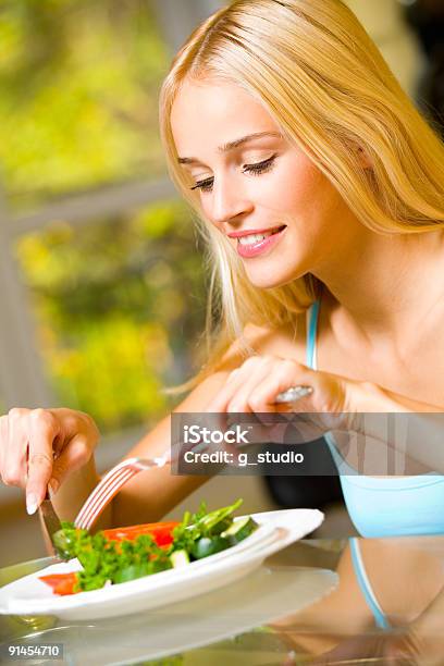 Portrait Of Young Happy Smiling Woman Eating Salad Stock Photo - Download Image Now - Adult, Adults Only, Autumn