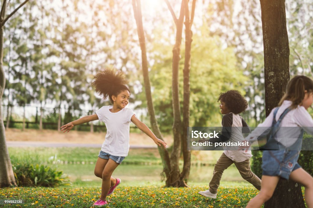 little girl playing outdoor Cute african american little girl playing outdoor - Black people kid and friend happy. Child Stock Photo