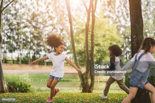 Little Girl Playing Outdoor Stock Photo - Download Image Now - Child, Playing, Playful