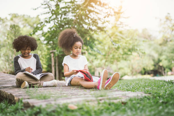 istock child girl reading book 914552334