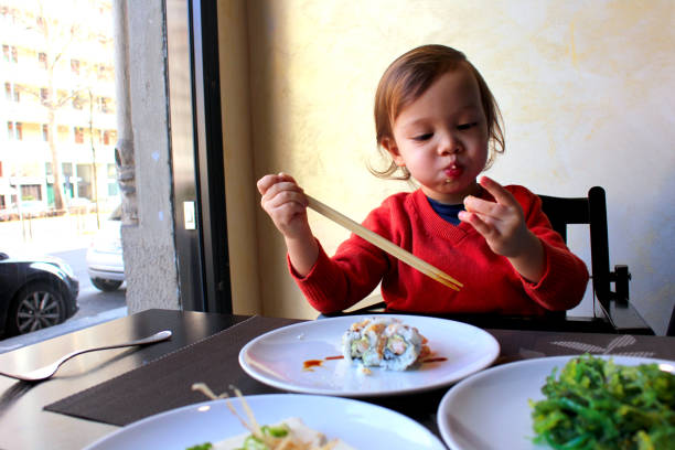 istock Toddler enjoy eating sushi 914558812