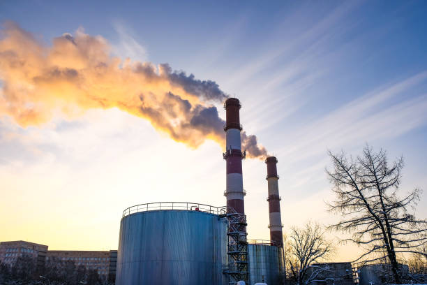 istock thick smoke belching from factory chimneys 914562200