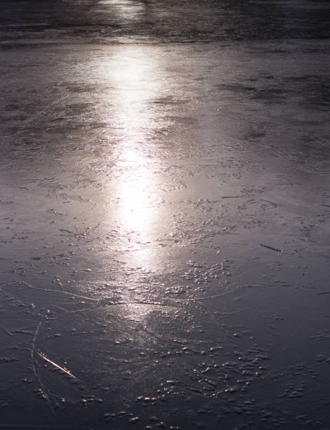 istock frozen lake at sunset. background, seasonal. 914563080