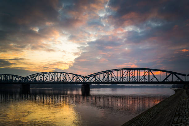 istock Bridge on the Vistula River lit by the setting sun. 914564278
