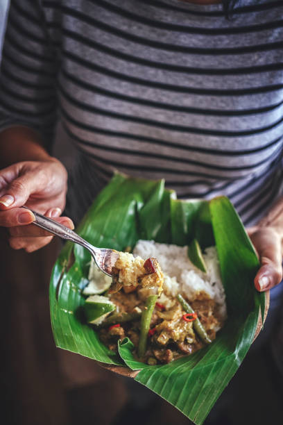 istock Indonesian Chicken Curry Dish with Rice Served on Banana Leaf 914570938
