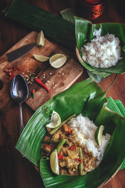 istock Indonesian Chicken Curry Dish with Rice Served on Banana Leaf 914570948
