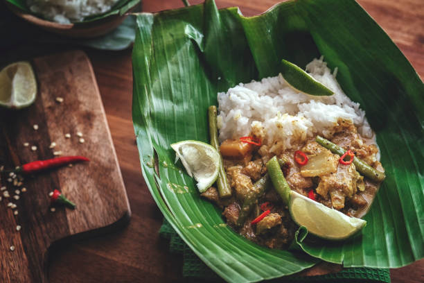 istock Indonesian Chicken Curry Dish with Rice Served on Banana Leaf 914570964
