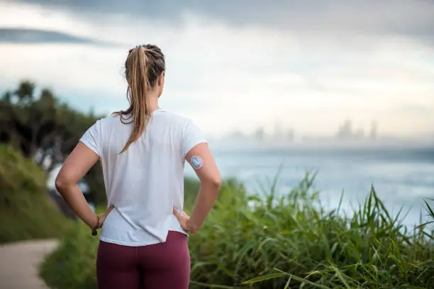 Woman with diabetes running in Australia