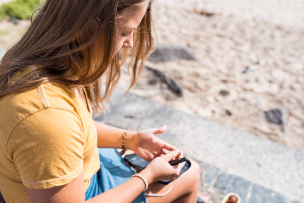 istock Young woman checking her blood glucose 914575894