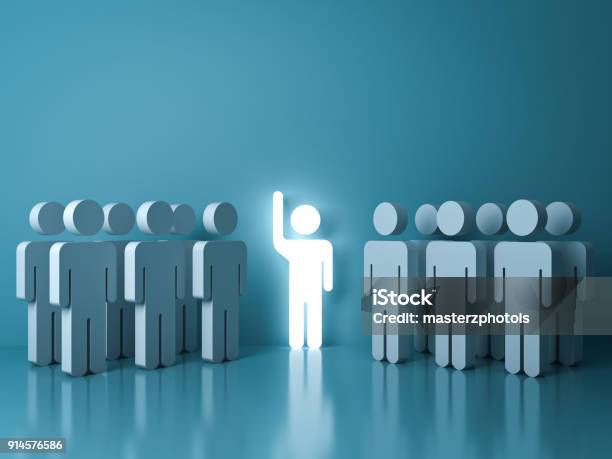 Stand Out From The Crowd And Different Concept One Glowing Light Man Raising His Hand Among Other People On Light Green Pastel Color Background With Reflections And Shadows Stock Photo - Download Image Now