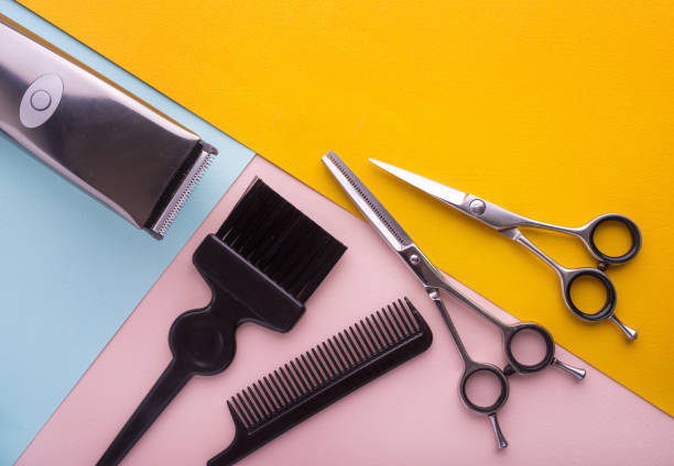 istock Hairdresser tools on color background with copy space at top. 914579480