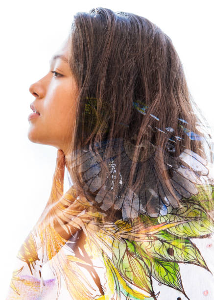 istock Paintography. Double exposure profile of a sensual peaceful model gently touching her face combined with hand drawn ink and watercolour paintings with floral motif 914584088