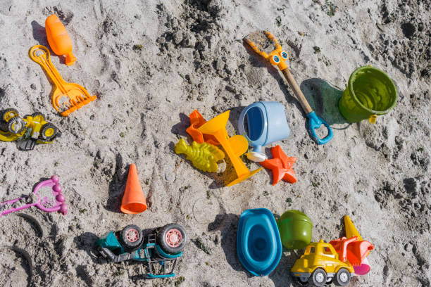 istock High Angle View Of Multi Colored Toys At Beach 914589156