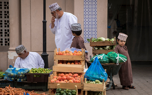 nizwa, Oman, Febrary 2nd, 2018: omani kid at a vegetable market