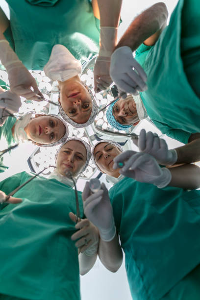 istock Team of nurses and surgeons in surgery 914589300