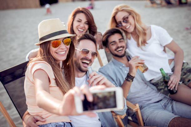 istock Group of friends having great time together on the beach. 914589754