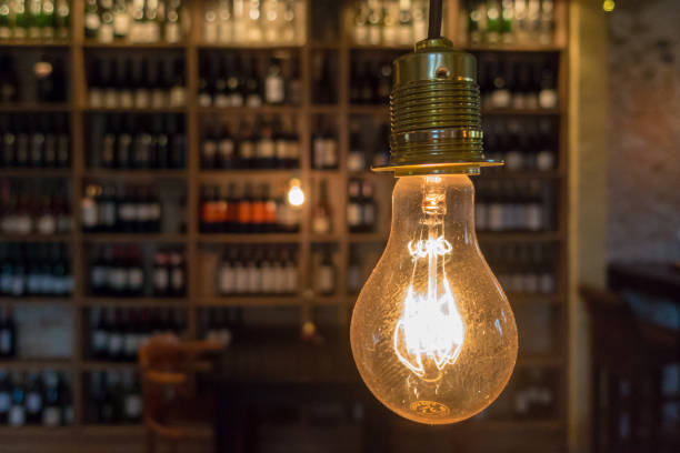 istock Close-Up Of Illuminated Light Bulb In Bar 914594056