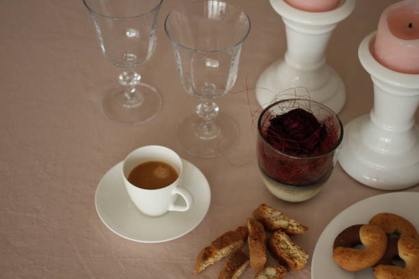 istock Romantic table with candles, red rose, plate, coffee, empty wine glasses and biscuits 914594330
