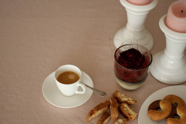 istock Romantic table with candles, red rose, plate, coffee and biscuits 914594426