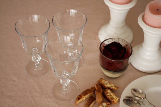 istock Romantic table with candles, red rose, plate, empty wine glasses and biscuits 914594604