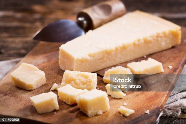 Pieces Of Parmesan Cheese Stock Photo - Download Image Now - Parmesan Cheese, Cheese, Cutting Board