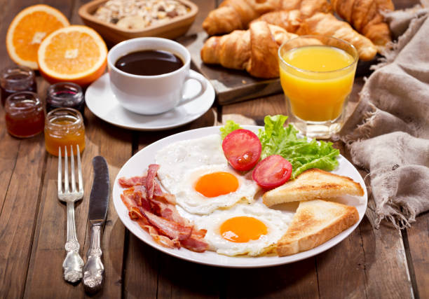istock breakfast with croissants, coffee, juice and fresh fruits 914599714