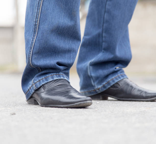 istock male legs in jeans and shoes 914609104