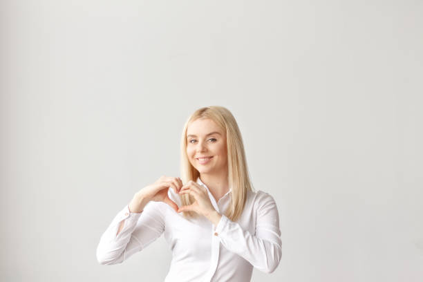 istock Valentine's day, heart hands, a young pretty girl 914609212