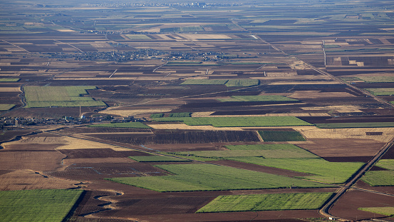 Savannah of Mardin with large and wide fields. Few towns and villages are seen in distant. Shot from a high angle viewpoint. No people are seen in frame.