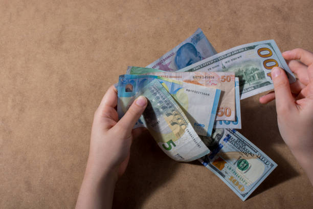 istock Hand holding American dollar  isolated on wooden background 914617878