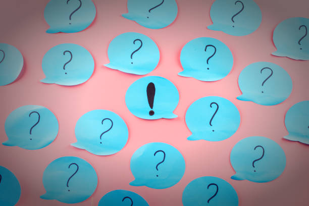 istock Background with stickers. Question marks written on blue papers. Exclamation point in the center. 914622244