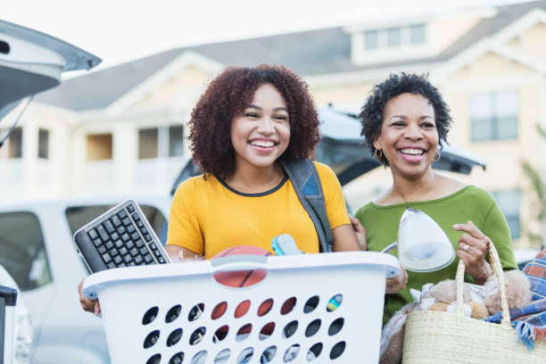 istock African-American mother helping daughter move 914624958