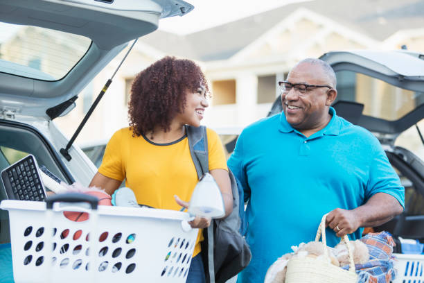 istock African-American father helping daughter move 914625058