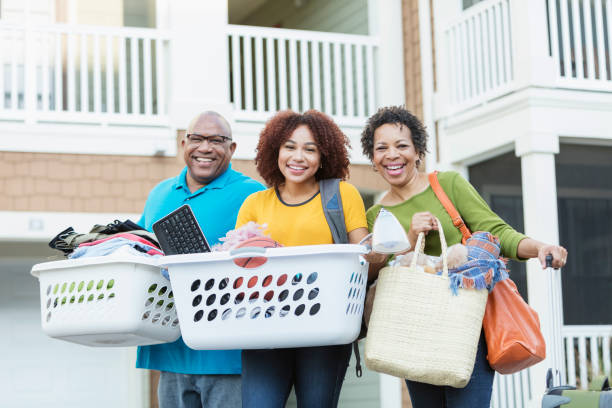 istock African-American parents helping daughter move 914625206