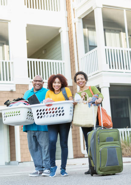 istock African-American parents helping daughter move 914625330