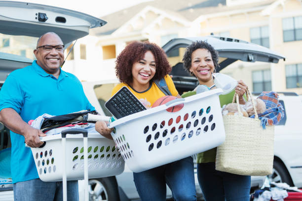 istock African-American parents helping daughter move 914625336